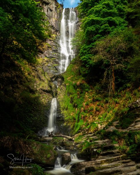 High falling water in waterfall and cascades at head of Pistyll Rhaeadr falls in Wales