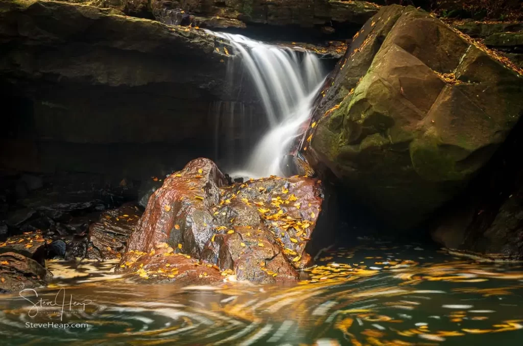 Cascade of waterfall into swimming hole with blurred motion on Deckers Creek running by Route 7 near Masontown in Preston County West Virginia