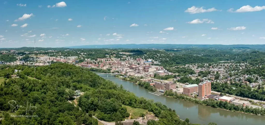 Aerial drone panoramic shot of the downtown area of Morgantown with the WVU campus in the fall