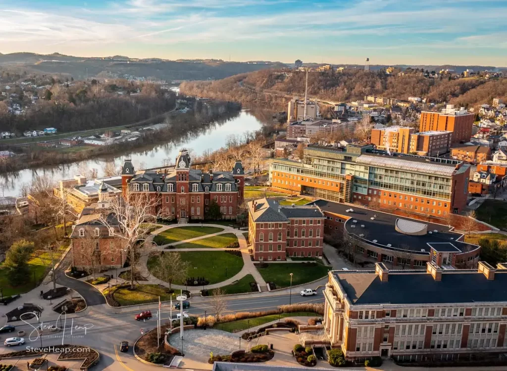 Aerial drone panoramic shot of the downtown campus of WVU in Morgantown West Virginia showing the river in the distance