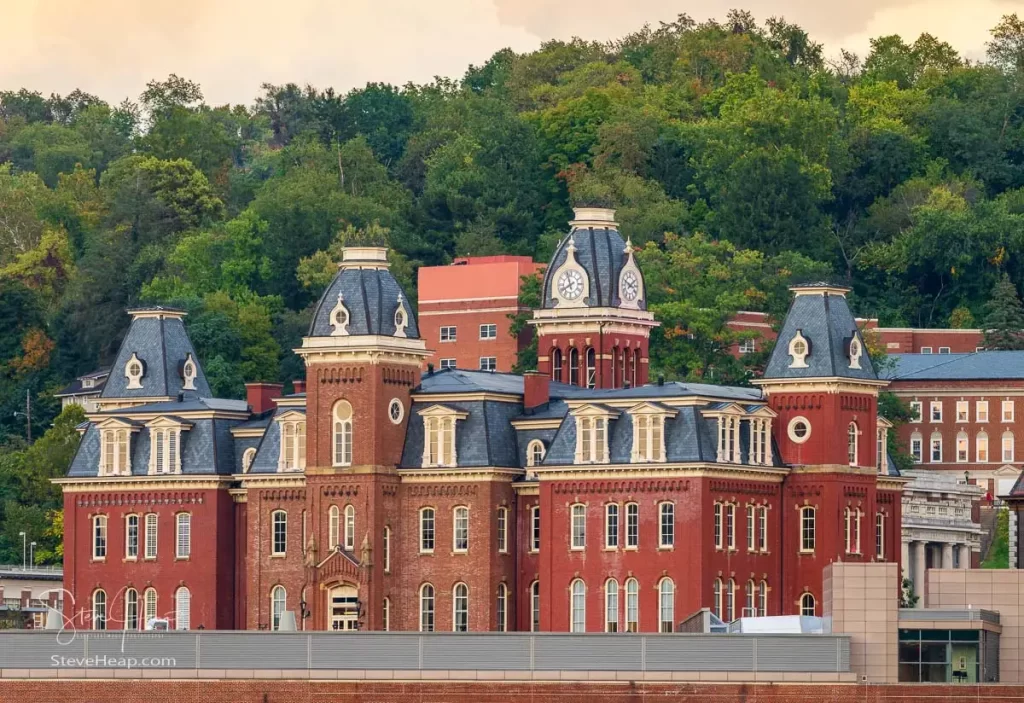 The old Woodburn Hall against the trees of downtown campus at West Virginia University in Morgantown