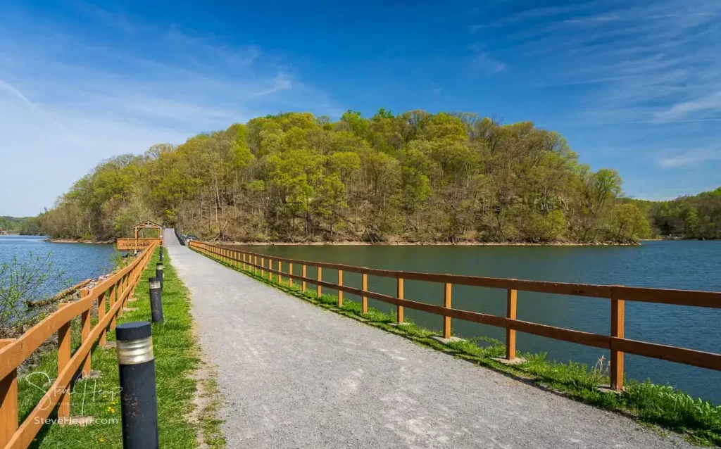 Warm light on the park at Cheat Lake near Morgantown West Virginia on a beautiful calm spring morning as the new leaves start to open on the trees