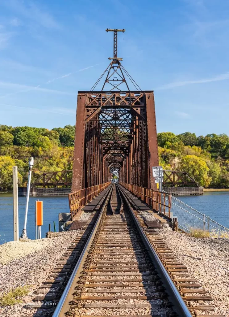 Historic Dubuque railroad bridge between Iowa and Illinois across the Mississippi river with swing span open for shipping