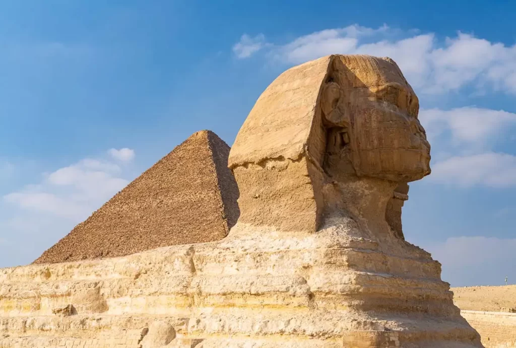 The Sphinx with one of the Giza pyramids behind