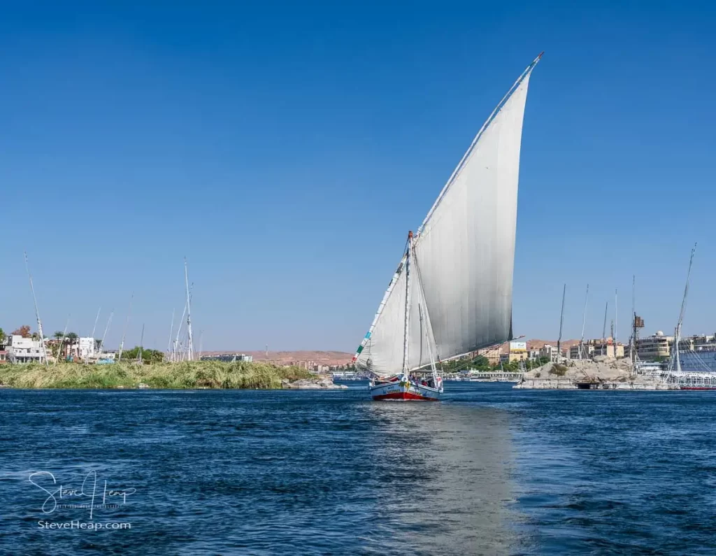 Sailing on the Nile in a traditional Felucca boat powered just by the wind