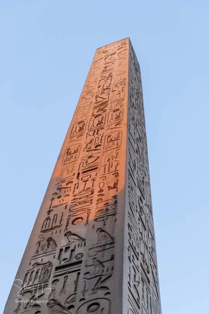 Hieroglyphics cover every surface of the massive obelisk by the front wall of the temple