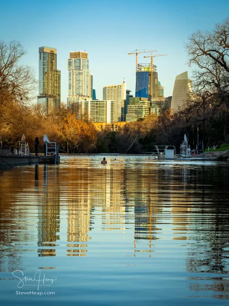 Swimmers in the Barton Springs swimming pool in Austin Texas on New Years Eve 2024. Prints available in my online store