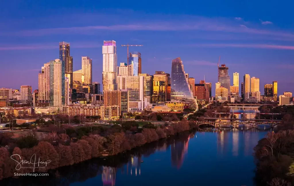 Evening skyline view of Austin Texas from Zilker park with the Colorado river in the foreground. Prints available in my online store.